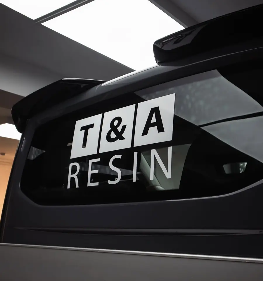 T&A Resin logo on a company van window