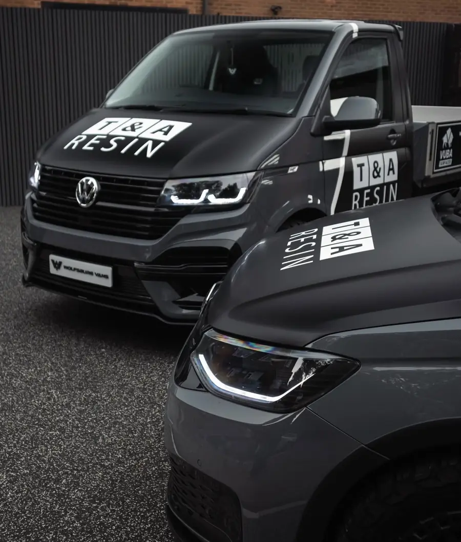 T&A Resin branded VW vans parked on a resin bound surface
